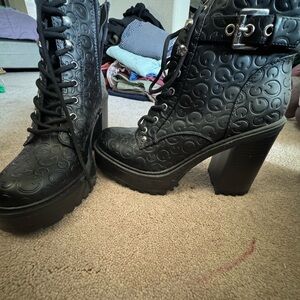 Stylish Black Lace-Up Boots with Embossed Design